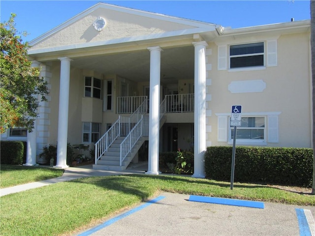 620 E Lake Jasmine Cir Unit 102, Vero Beach, FL 32962 - view of building exterior featuring stairs