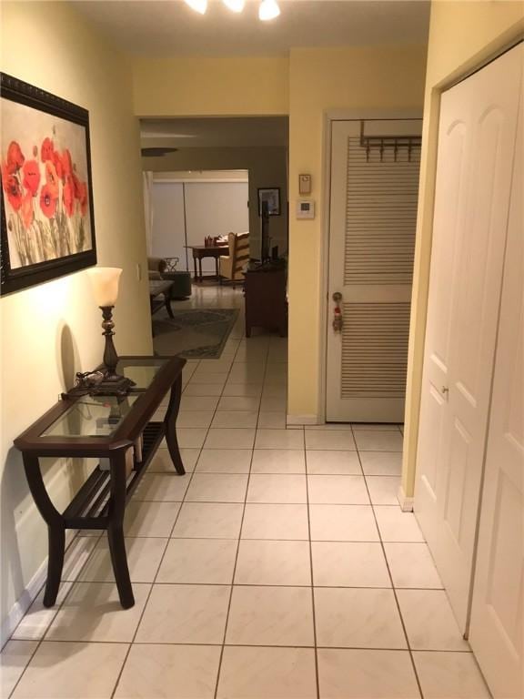 620 E Lake Jasmine Cir Unit 102, Vero Beach, FL 32962 - corridor featuring light tile patterned floors and baseboards