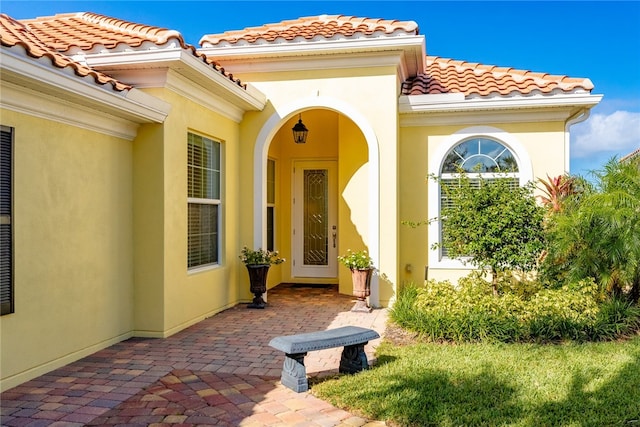 property entrance with a patio