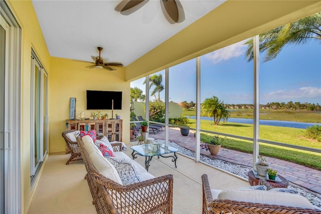 sunroom / solarium with ceiling fan