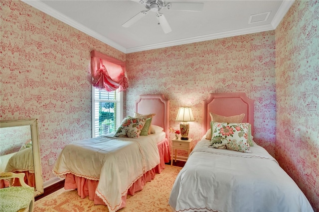 bedroom featuring hardwood / wood-style flooring, ceiling fan, and crown molding