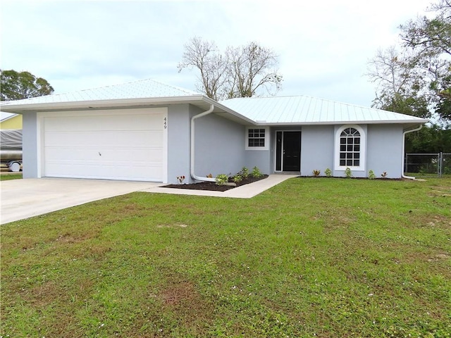 ranch-style home featuring a garage and a front lawn