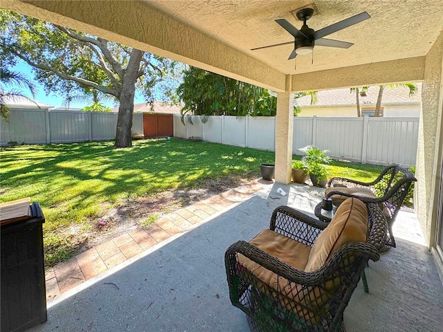 view of patio / terrace featuring ceiling fan