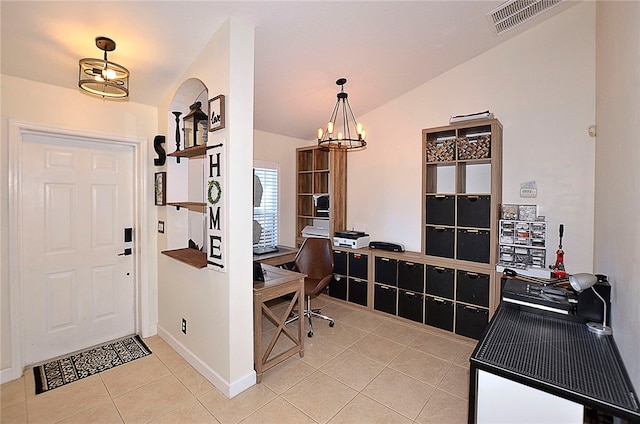 office space featuring a chandelier, light tile patterned floors, and vaulted ceiling