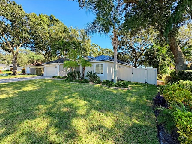 ranch-style house with a garage and a front yard