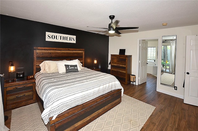 bedroom featuring a textured ceiling, access to outside, dark hardwood / wood-style flooring, and ceiling fan