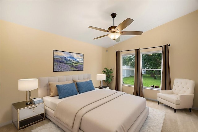 bedroom featuring ceiling fan and lofted ceiling