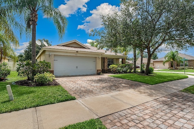 ranch-style house with a front lawn and a garage