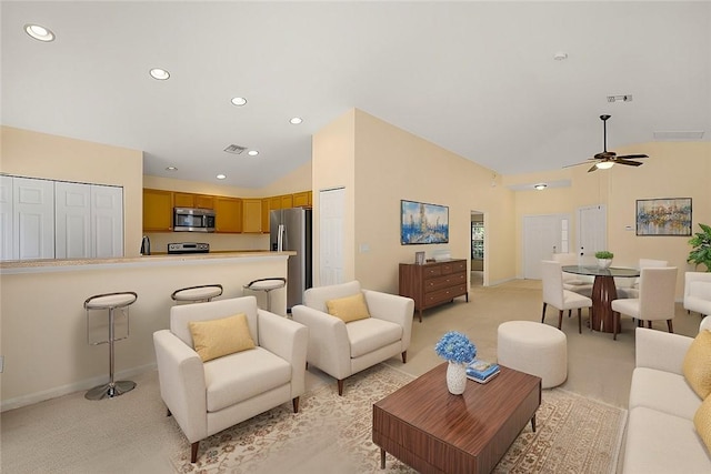 living room with light carpet, vaulted ceiling, and ceiling fan