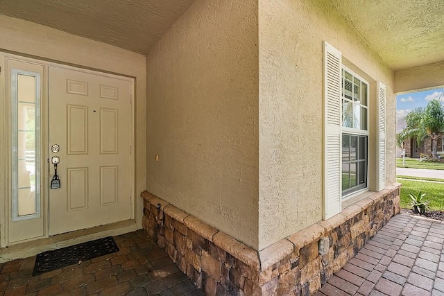 property entrance featuring covered porch