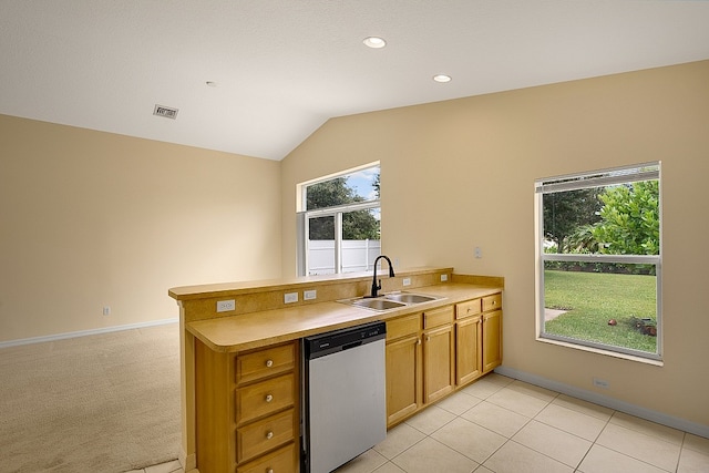 kitchen with dishwasher, kitchen peninsula, vaulted ceiling, and sink