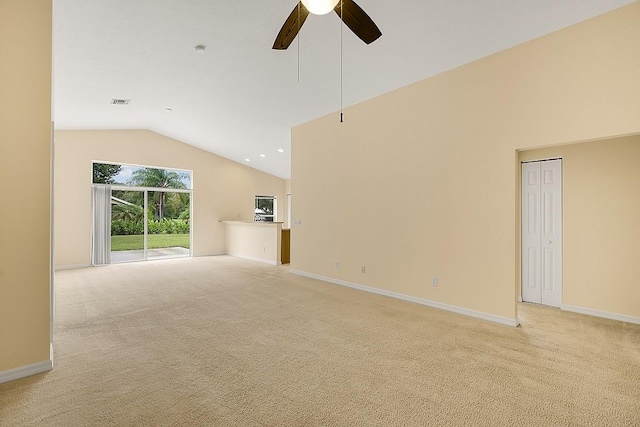 unfurnished living room featuring ceiling fan, light carpet, and vaulted ceiling