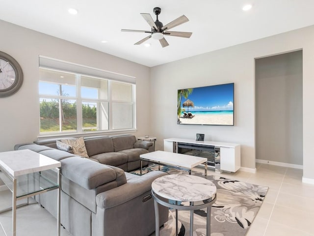 tiled living room with ceiling fan