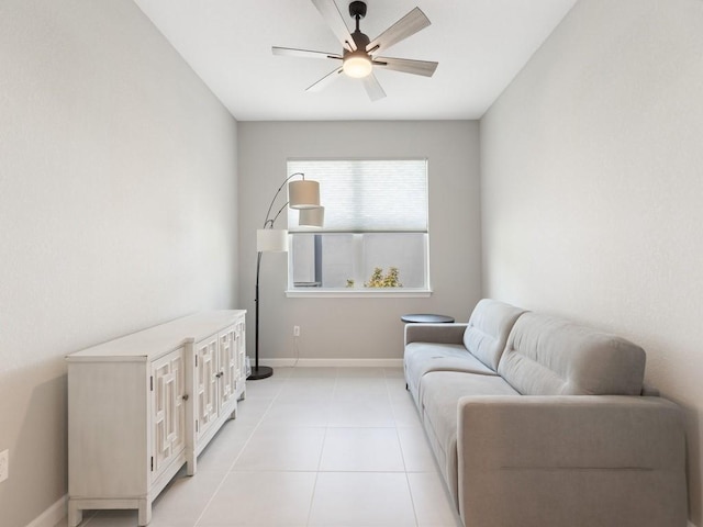 sitting room featuring light tile patterned floors and ceiling fan