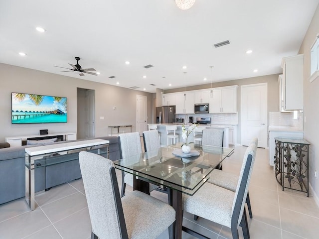 dining room featuring ceiling fan and light tile patterned floors