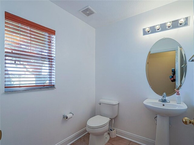1544 Par Ct, Vero Beach, FL 32966 - half bath with toilet and tile patterned floors