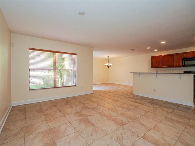1544 Par Ct, Vero Beach, FL 32966 - unfurnished living room featuring a chandelier, recessed lighting, and light tile patterned flooring