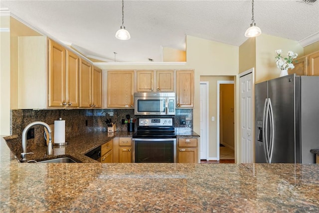kitchen featuring dark stone counters, decorative backsplash, stainless steel appliances, a sink, and hanging light fixtures