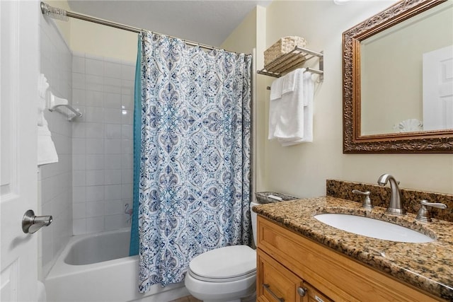 full bathroom featuring shower / bath combo, vanity, and toilet