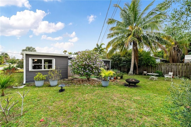 view of yard with an outdoor fire pit