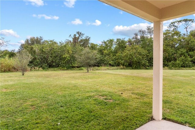 back of house with a lawn