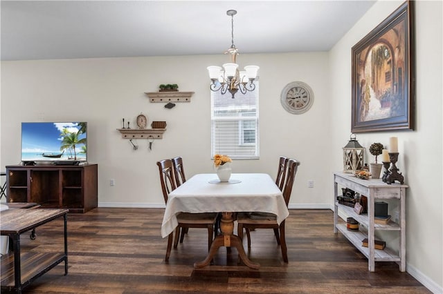 dining room featuring a chandelier and dark hardwood / wood-style floors