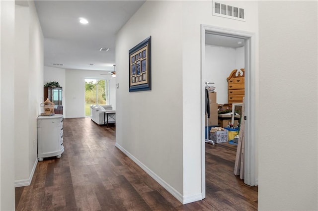 corridor featuring dark wood-type flooring