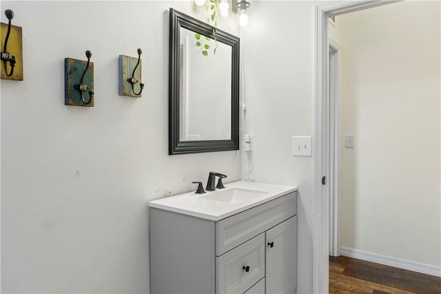 bathroom with vanity and hardwood / wood-style floors