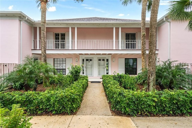 view of front of home with a balcony