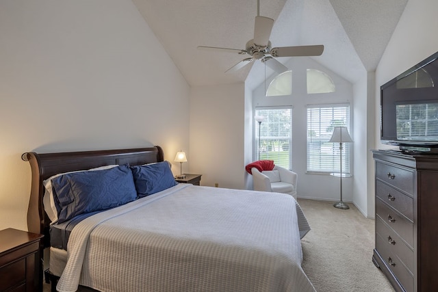 bedroom featuring ceiling fan, light carpet, and vaulted ceiling