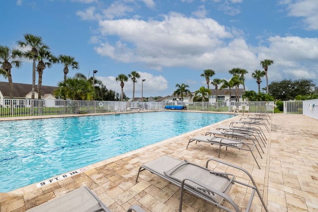 view of swimming pool featuring a patio area