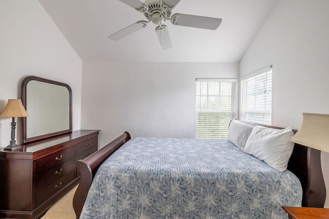 carpeted bedroom featuring lofted ceiling and ceiling fan