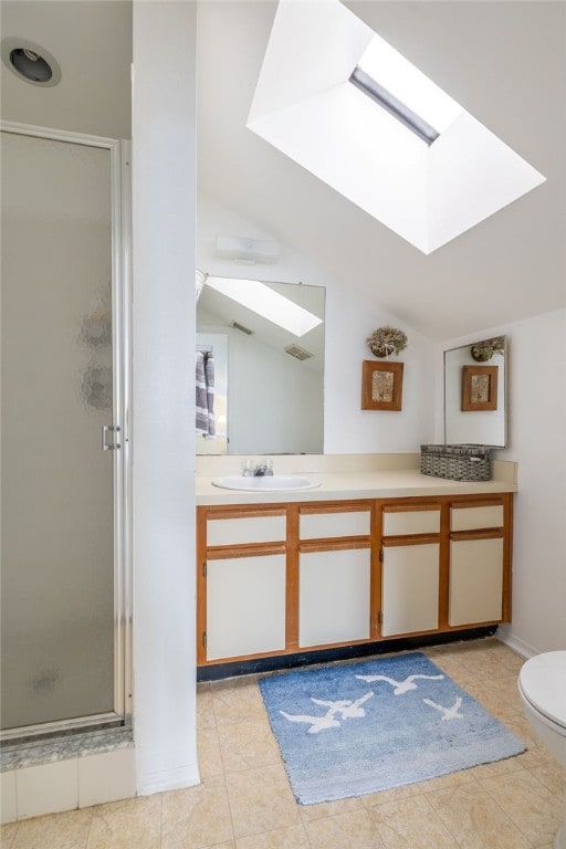 bathroom with walk in shower, vaulted ceiling with skylight, toilet, and tile patterned flooring