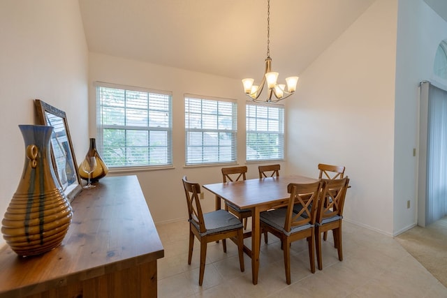 dining space with an inviting chandelier and vaulted ceiling