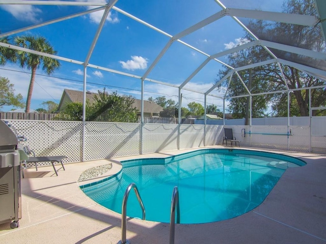 view of pool featuring a lanai and a patio