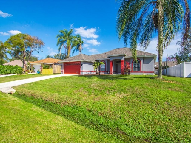 ranch-style house featuring a garage and a front yard