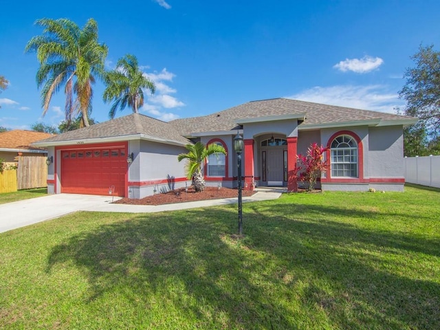 single story home with a garage and a front yard