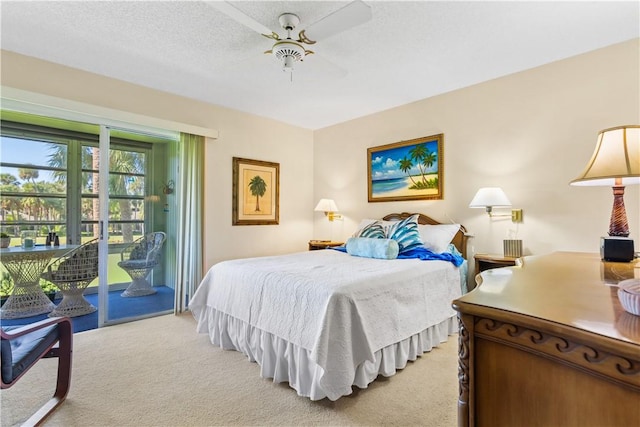 bedroom with light carpet, ceiling fan, a textured ceiling, and access to exterior