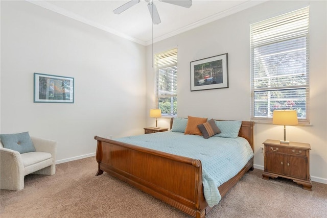 bedroom with ornamental molding, light colored carpet, and ceiling fan