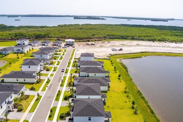aerial perspective of suburban area with a large body of water