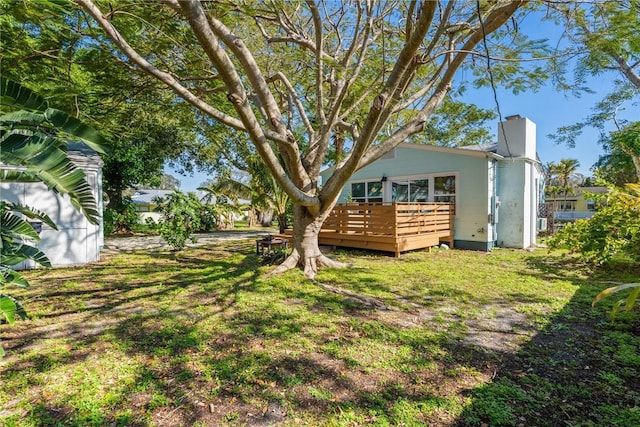 view of yard featuring a wooden deck