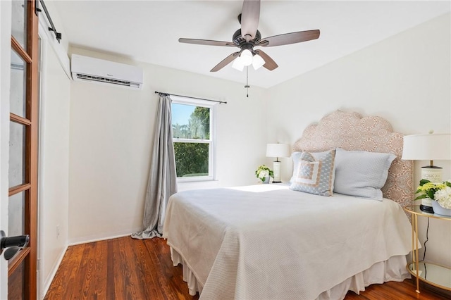 bedroom featuring ceiling fan, dark hardwood / wood-style flooring, and a wall mounted AC