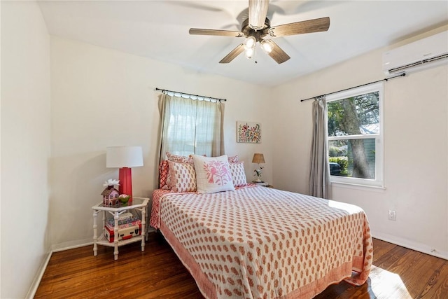 bedroom with dark wood-type flooring, ceiling fan, and a wall mounted AC