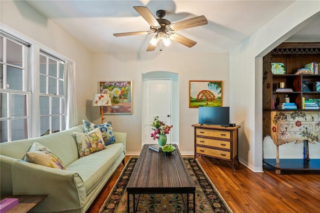 sitting room featuring ceiling fan and dark hardwood / wood-style flooring