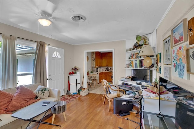 office space with light wood-style floors and visible vents