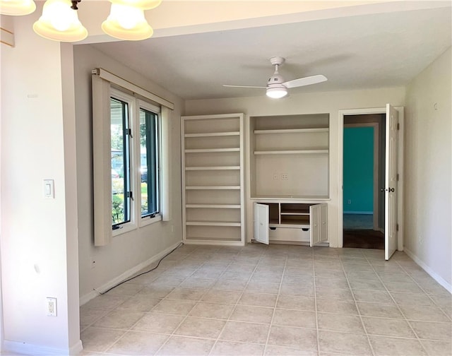 unfurnished bedroom featuring an inviting chandelier and light tile patterned floors