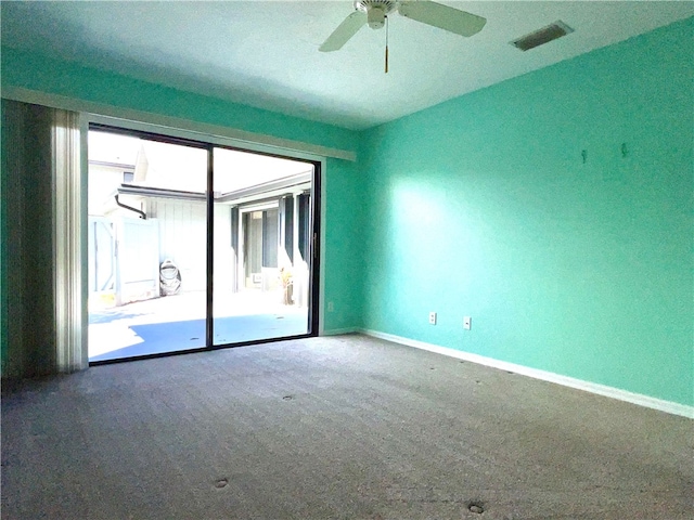 empty room with carpet and ceiling fan