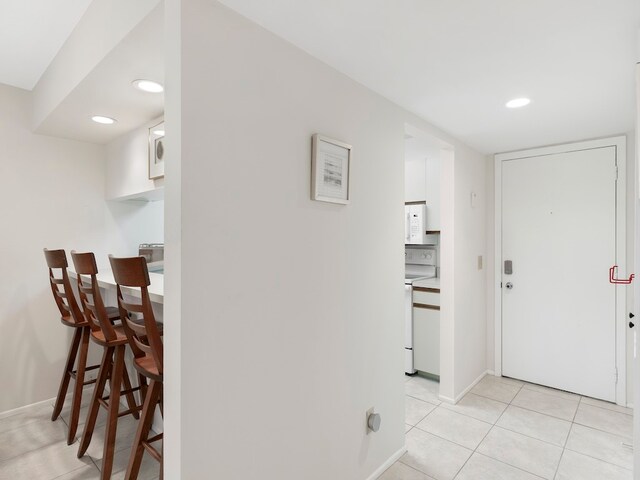 hallway with light tile patterned flooring