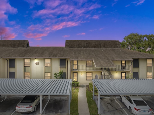 view of back house at dusk