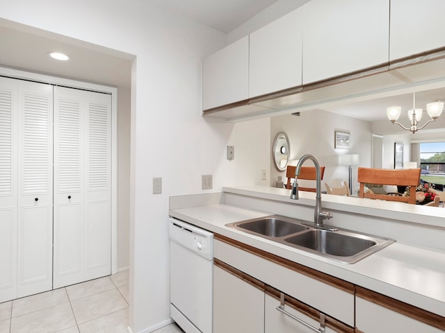 kitchen with dishwasher, white cabinets, decorative light fixtures, and an inviting chandelier